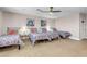 Bedroom with three twin beds and geometric bedding at 821 Mar Jay Ct, Las Vegas, NV 89107