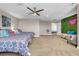 Bedroom with two twin beds, seating area, and green wall at 821 Mar Jay Ct, Las Vegas, NV 89107