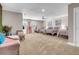 Spacious bedroom with three twin beds, seating area, and large windows at 821 Mar Jay Ct, Las Vegas, NV 89107