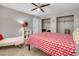 Bedroom with a queen-size bed, closet, and stylish decor at 821 Mar Jay Ct, Las Vegas, NV 89107