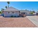 Ranch style home with gray exterior and rock landscaping at 821 Mar Jay Ct, Las Vegas, NV 89107