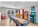 Game room with shuffleboard, foosball, and arcade games, plus a view of the pool at 821 Mar Jay Ct, Las Vegas, NV 89107
