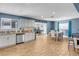 Open kitchen with granite counters, stainless steel appliances, and game room access at 821 Mar Jay Ct, Las Vegas, NV 89107