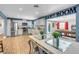 Open concept kitchen with stainless steel appliances and a view of the game room at 821 Mar Jay Ct, Las Vegas, NV 89107