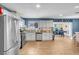 Updated kitchen, stainless steel appliances, granite counters, game room view at 821 Mar Jay Ct, Las Vegas, NV 89107