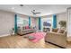 Living room with two sofas, pink rug, and mountain view at 821 Mar Jay Ct, Las Vegas, NV 89107
