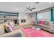 Spacious living room featuring comfortable sofas, a large glass coffee table, and a pink rug at 821 Mar Jay Ct, Las Vegas, NV 89107