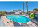 Inviting kidney-shaped pool with patio furniture and landscaping at 821 Mar Jay Ct, Las Vegas, NV 89107