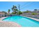 Inviting kidney shaped pool with surrounding patio furniture at 821 Mar Jay Ct, Las Vegas, NV 89107
