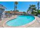 Kidney shaped pool with patio furniture and BBQ area at 821 Mar Jay Ct, Las Vegas, NV 89107