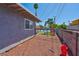 Side yard with gravel and a view of the pool and fence at 821 Mar Jay Ct, Las Vegas, NV 89107