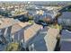 Aerial view of houses and neighborhood with school in background at 9068 Alluring Ave, Las Vegas, NV 89149