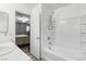Updated bathroom with a shower and bathtub at 9068 Alluring Ave, Las Vegas, NV 89149