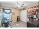Bedroom with a desk, closet, and unique wall decor at 9068 Alluring Ave, Las Vegas, NV 89149