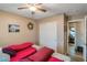 Bedroom with twin beds, double doors to closet, and access to another room at 9068 Alluring Ave, Las Vegas, NV 89149