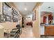 Bright hallway with tile flooring, offering views of the living room and kitchen at 9068 Alluring Ave, Las Vegas, NV 89149