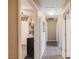 Upstairs hallway with light walls and doors to bedrooms at 9068 Alluring Ave, Las Vegas, NV 89149