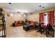 Spacious living room featuring comfortable seating and a tile floor at 9068 Alluring Ave, Las Vegas, NV 89149