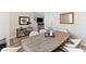 Modern dining room features a large table and neutral decor at 10509 Ingelow Ct, Las Vegas, NV 89166