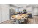 Modern kitchen with island, stainless steel appliances, and light wood floors at 10509 Ingelow Ct, Las Vegas, NV 89166
