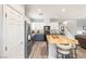 Modern kitchen with island, stainless steel appliances, and light wood floors at 10509 Ingelow Ct, Las Vegas, NV 89166