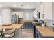 Modern kitchen with island, stainless steel appliances, and light wood floors at 10509 Ingelow Ct, Las Vegas, NV 89166