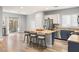 Modern kitchen with island, stainless steel appliances, and light wood floors at 10509 Ingelow Ct, Las Vegas, NV 89166