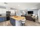 Modern kitchen with island, stainless steel appliances, and light wood floors at 10509 Ingelow Ct, Las Vegas, NV 89166