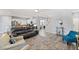 Open concept living room with kitchen and staircase views at 10509 Ingelow Ct, Las Vegas, NV 89166