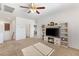 Spacious living room featuring a built-in entertainment center and fireplace at 10509 Ingelow Ct, Las Vegas, NV 89166