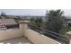 Large balcony with decorative iron railing provides panoramic views of the surrounding community at 12243 Pacific Cruise Ave, Las Vegas, NV 89138