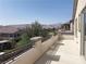 Open-air balcony shows views of the nearby desert landscape at 12243 Pacific Cruise Ave, Las Vegas, NV 89138