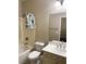 Bright bathroom featuring a tub-shower combo with white vanity and framed mirror at 12243 Pacific Cruise Ave, Las Vegas, NV 89138