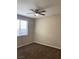 Bedroom with plush carpet, large window, and neutral color scheme throughout at 12243 Pacific Cruise Ave, Las Vegas, NV 89138