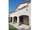 Spacious outdoor covered patio area with stone pillars and upper level balcony at 12243 Pacific Cruise Ave, Las Vegas, NV 89138