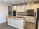 This kitchen features granite countertops, stainless steel appliances, and custom cabinets at 12243 Pacific Cruise Ave, Las Vegas, NV 89138