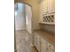 Open concept kitchen with custom cabinetry, granite countertops, and views of the living space at 12243 Pacific Cruise Ave, Las Vegas, NV 89138