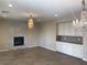 Living room featuring wood look tile floors, fireplace, and custom cabinetry at 12243 Pacific Cruise Ave, Las Vegas, NV 89138