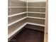 Walk-in pantry with wooden shelving provides ample storage space at 12243 Pacific Cruise Ave, Las Vegas, NV 89138