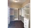 Walk-in closet featuring built-in shelving units and carpet at 12243 Pacific Cruise Ave, Las Vegas, NV 89138
