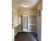 Walk-in closet with built-in shelving, hanging racks, and carpet at 12243 Pacific Cruise Ave, Las Vegas, NV 89138