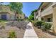 Well-maintained common area with walkways and mature trees, creating a welcoming atmosphere at 1701 King James St # 101, Las Vegas, NV 89144