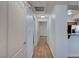 Hallway with wood-look floors that connects to kitchen and bedroom at 1701 King James St # 101, Las Vegas, NV 89144