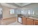 Open kitchen with granite counters and stainless steel dishwasher near the dining area at 1701 King James St # 101, Las Vegas, NV 89144