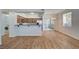 Living room with open kitchen featuring stainless appliances and access to patio at 1701 King James St # 101, Las Vegas, NV 89144