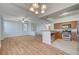 Living room with wood floors, stainless appliances, and eat-in bar at 1701 King James St # 101, Las Vegas, NV 89144