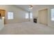 Spacious living room, featuring a fireplace and kitchen views at 2228 Summerwind Cir, Henderson, NV 89052