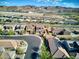 Aerial view of house and neighborhood with lake at 25 Via Corvina, Henderson, NV 89011