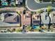 Aerial view showcasing a house with a private pool and surrounding homes at 25 Via Corvina, Henderson, NV 89011