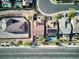 Aerial view showcasing a house with a private pool and surrounding homes at 25 Via Corvina, Henderson, NV 89011